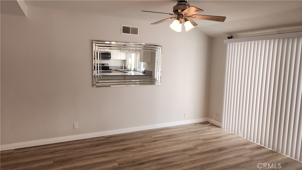 1617 Sunset Lane Fullerton, CA 92833 - Photo 5 of 18 a view of empty room with wooden floor and fan