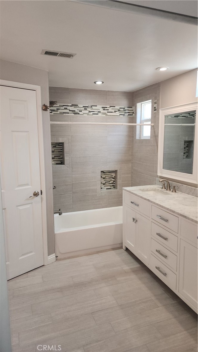 1617 Sunset Lane Fullerton, CA 92833 - Photo 8 of 18 a spacious bathroom with a double vanity sink a mirror and a bathtub
