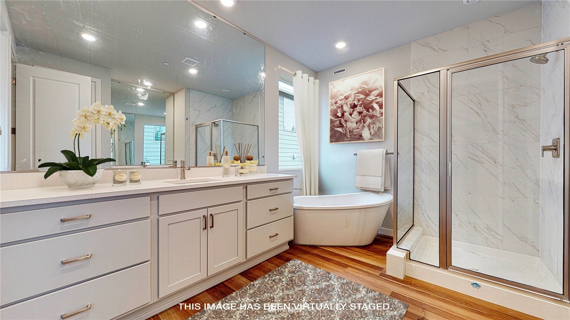 28 215th Street Southeast Bothell, WA 98021 - Photo 14 of 25 a spacious bathroom with a double vanity sink a toilet a mirror and shower