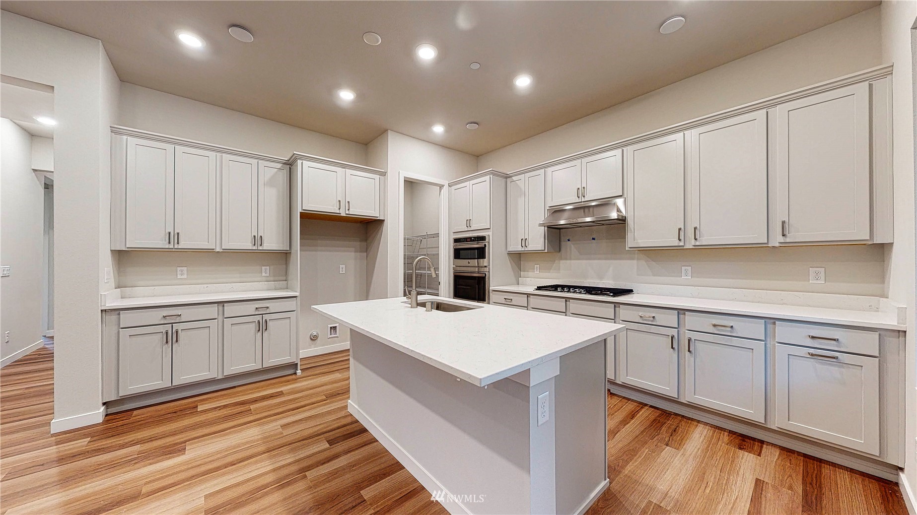 28 215th Street Southeast Bothell, WA 98021 - Photo 9 of 25 a kitchen with a sink stove and refrigerator