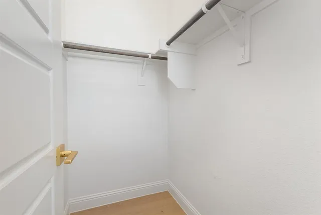 a kitchen with granite countertop a stove and a refrigerator