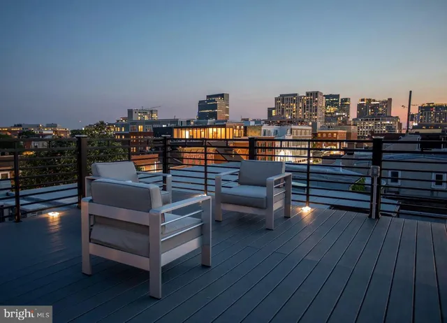 a view of a chairs and table in a patio