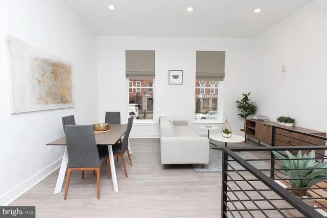 a dining room with furniture and window