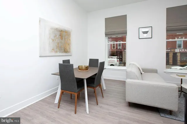 a dining room with furniture and window