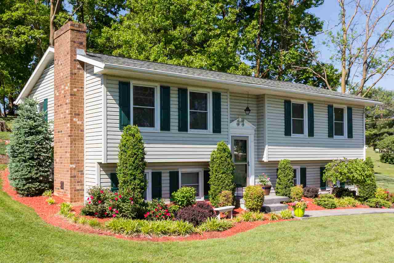 A beautifully maintained split foyer home with amazing mountain views on almost an acre!