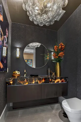 a living room with furniture and a book shelf