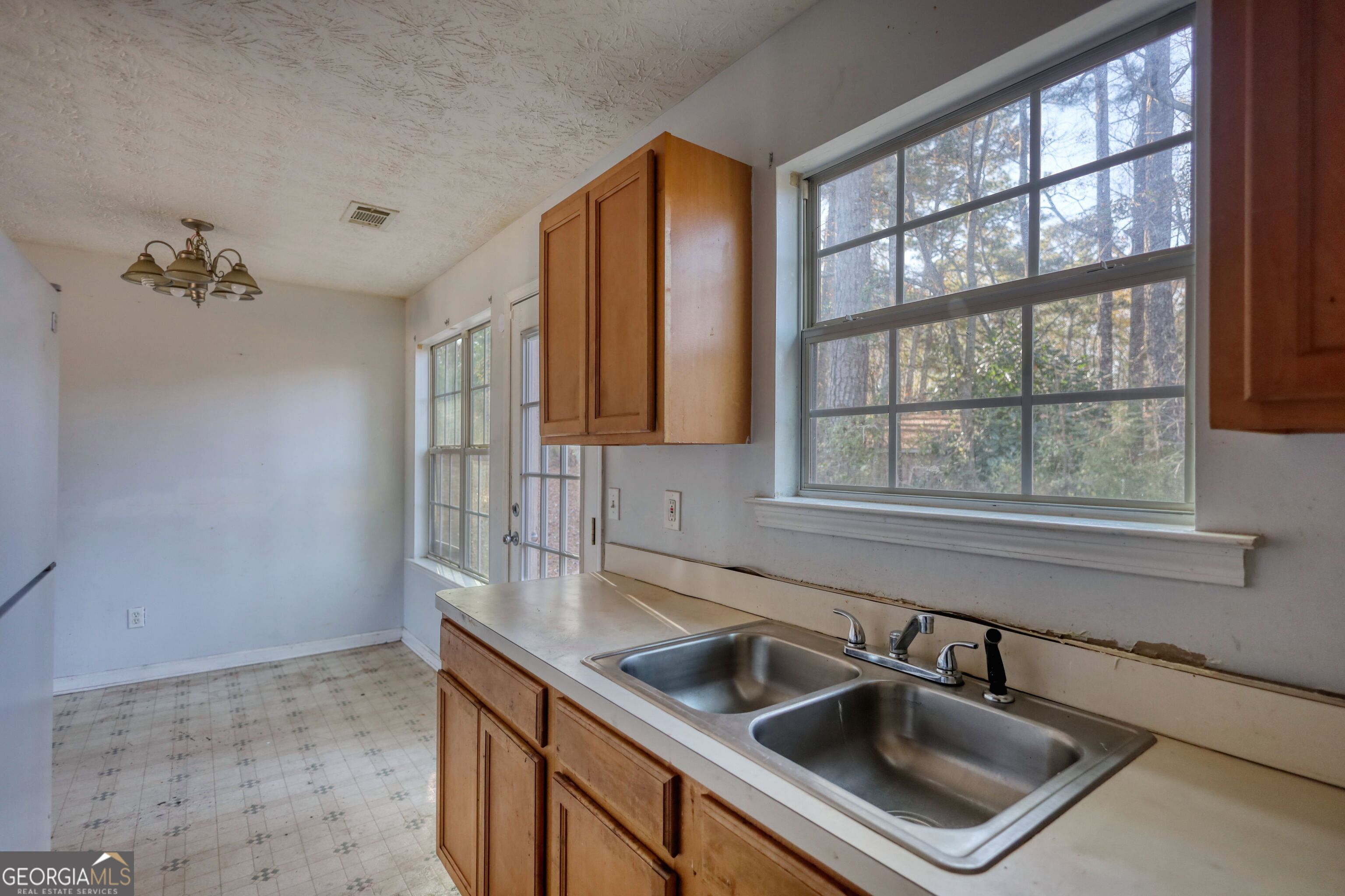 253 Nancy Street Monticello, GA 31064 - Photo 14 of 34 a kitchen that has a sink and a window