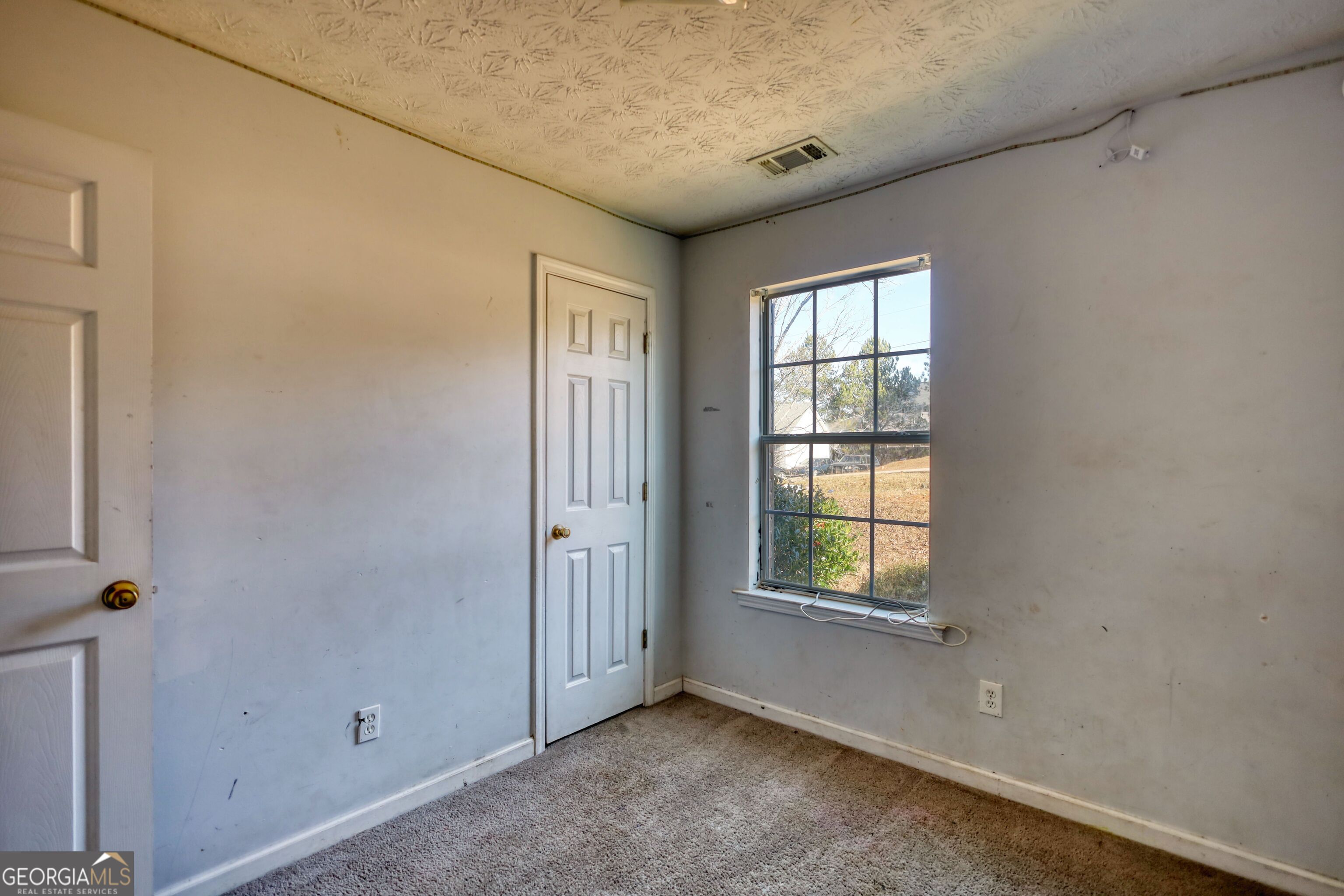 253 Nancy Street Monticello, GA 31064 - Photo 20 of 34 an empty room with windows