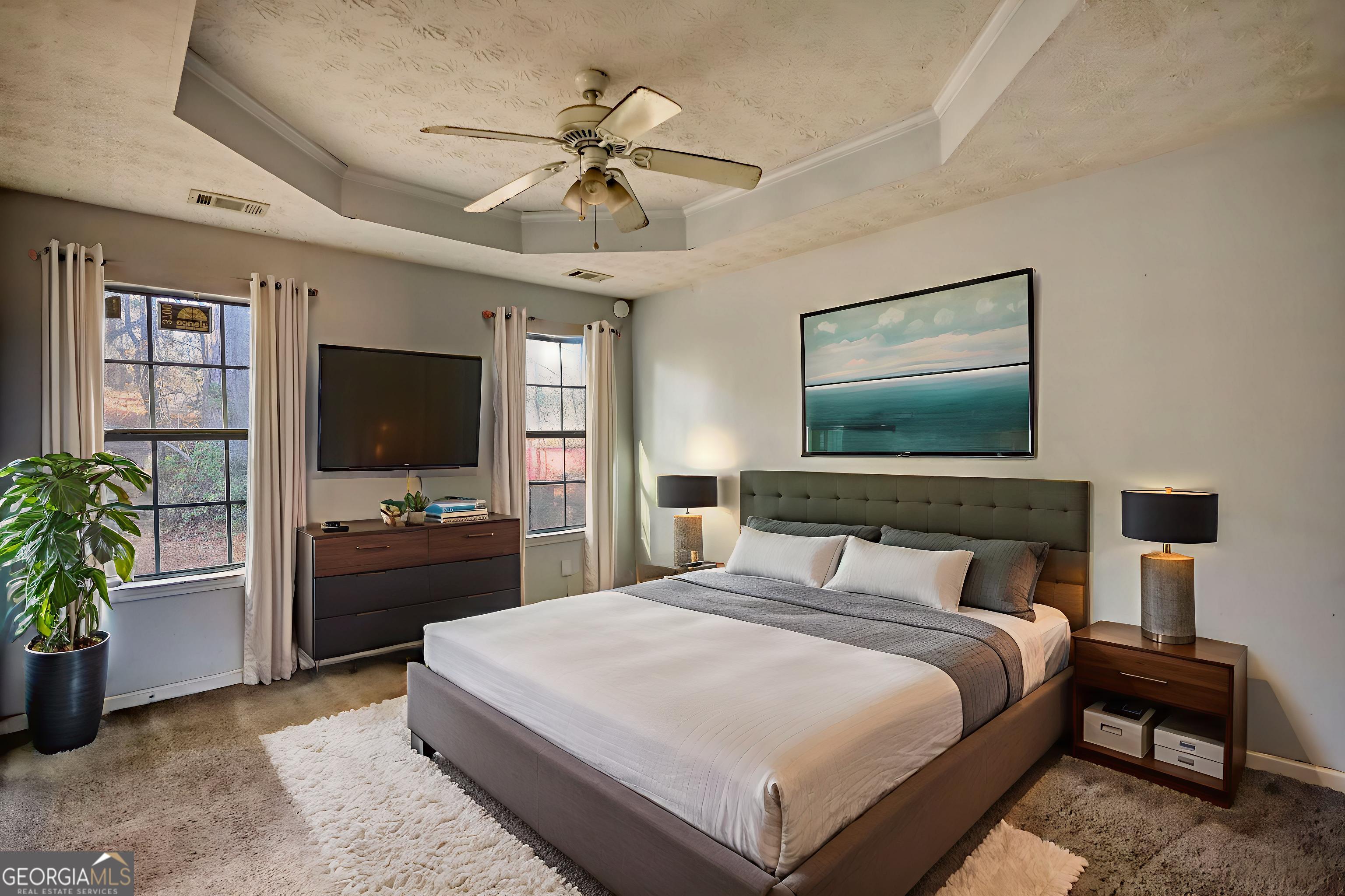 253 Nancy Street Monticello, GA 31064 - Photo 23 of 34 a bedroom with a bed and a flat screen tv