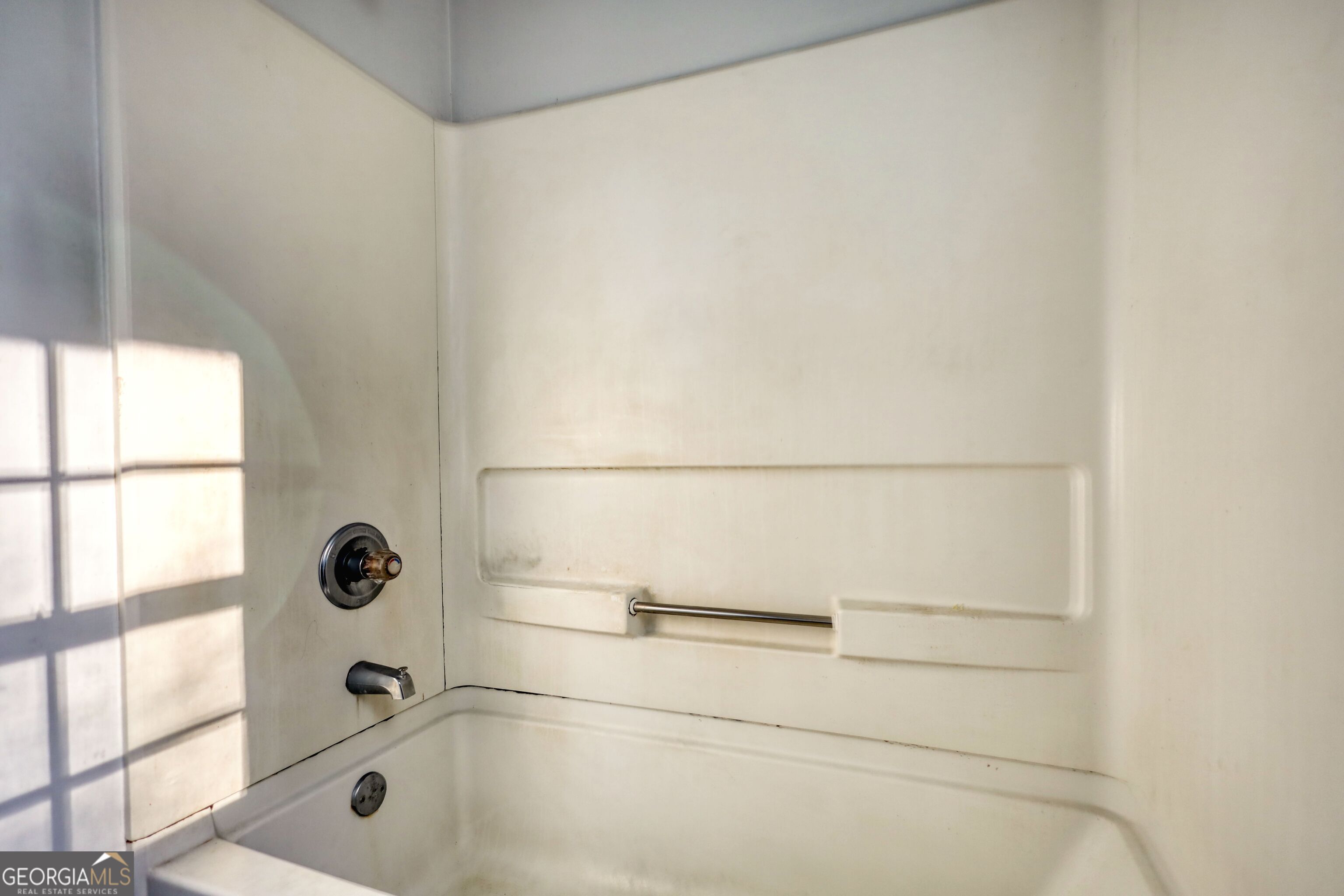 253 Nancy Street Monticello, GA 31064 - Photo 27 of 34 a bathroom with a glass shower door