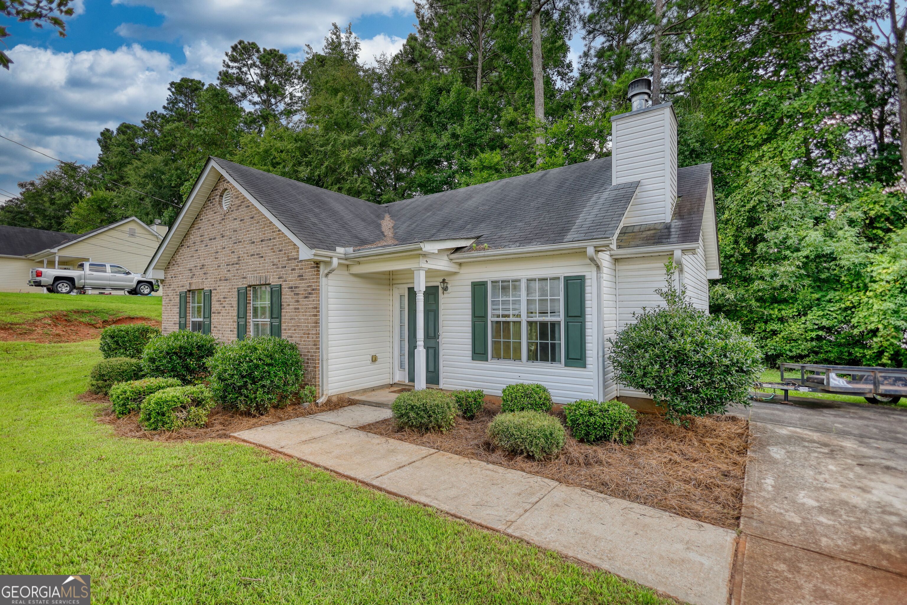 253 Nancy Street Monticello, GA 31064 - Photo 29 of 34 a front view of a house with a yard