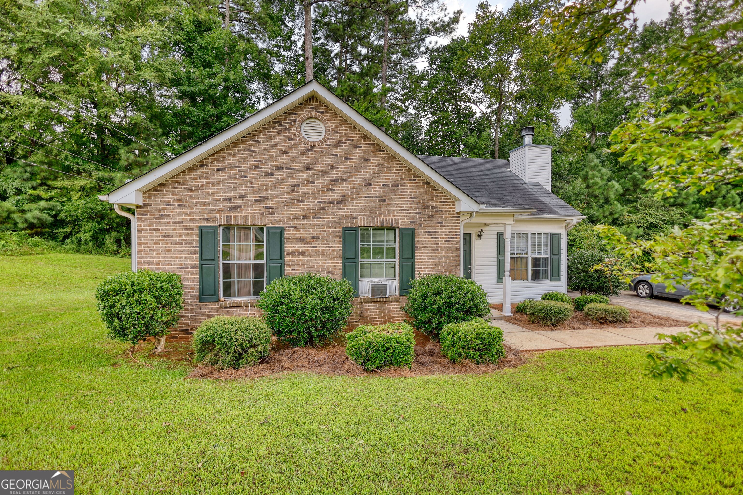253 Nancy Street Monticello, GA 31064 - Photo 30 of 34 a view of a house with backyard and garden