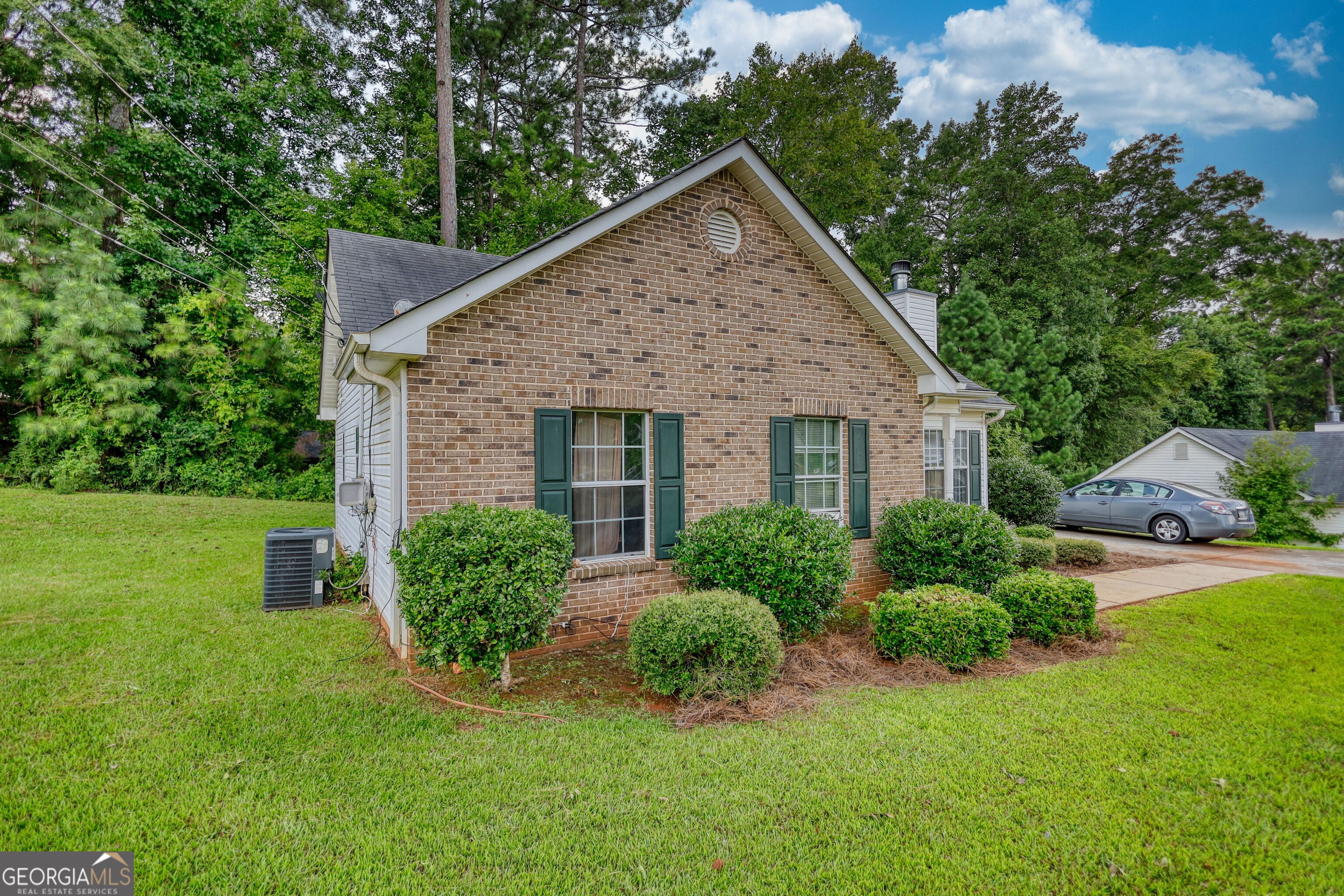 253 Nancy Street Monticello, GA 31064 - Photo 31 of 34 a view of a house with garden and yard