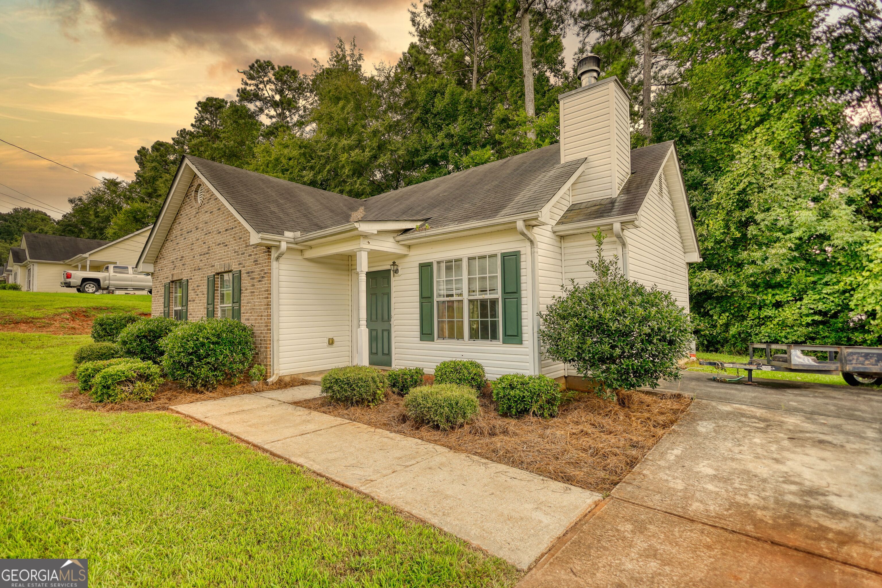 253 Nancy Street Monticello, GA 31064 - Photo 33 of 34 a front view of a house with garden