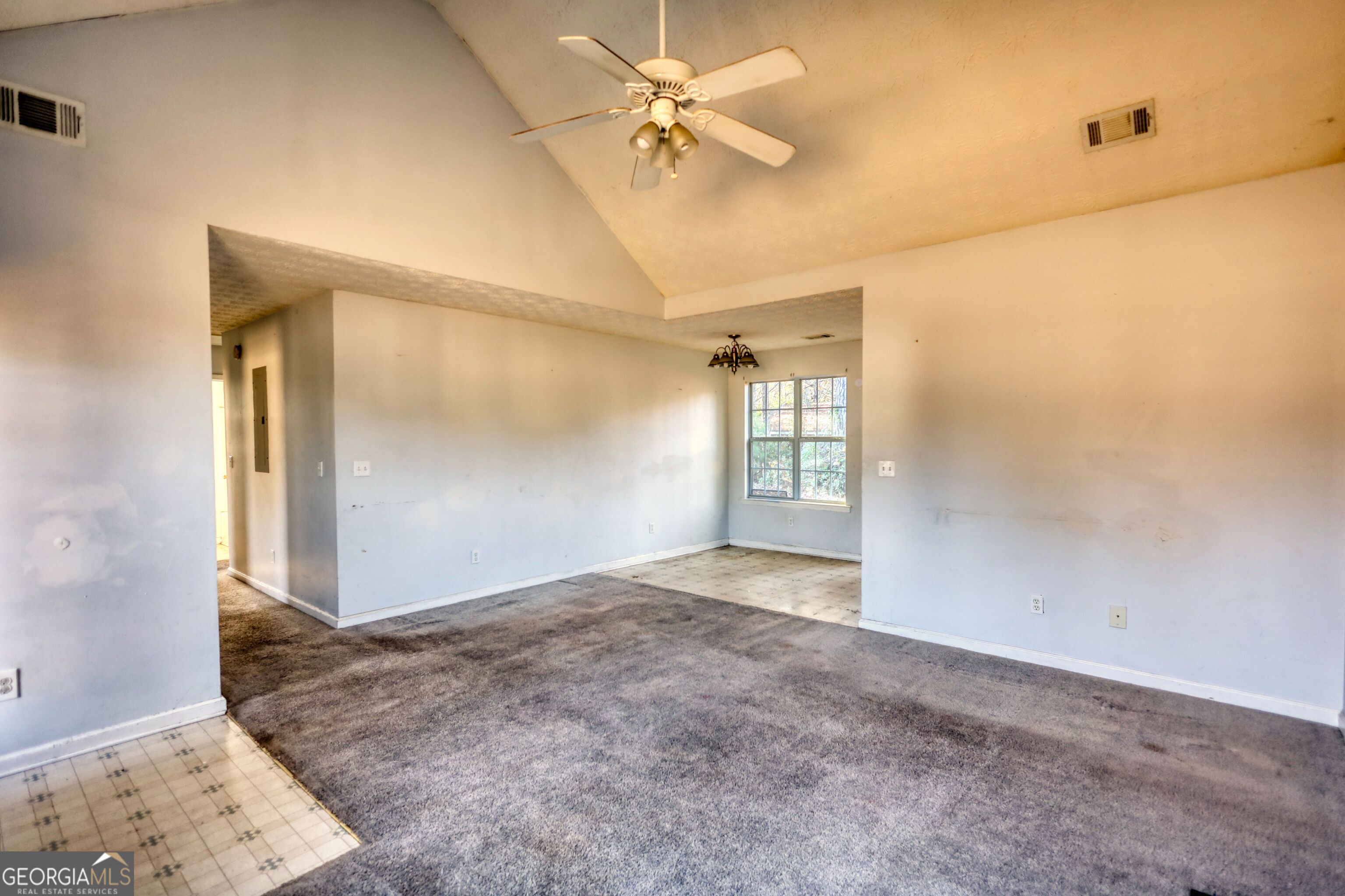 253 Nancy Street Monticello, GA 31064 - Photo 5 of 34 an empty room with windows and fan