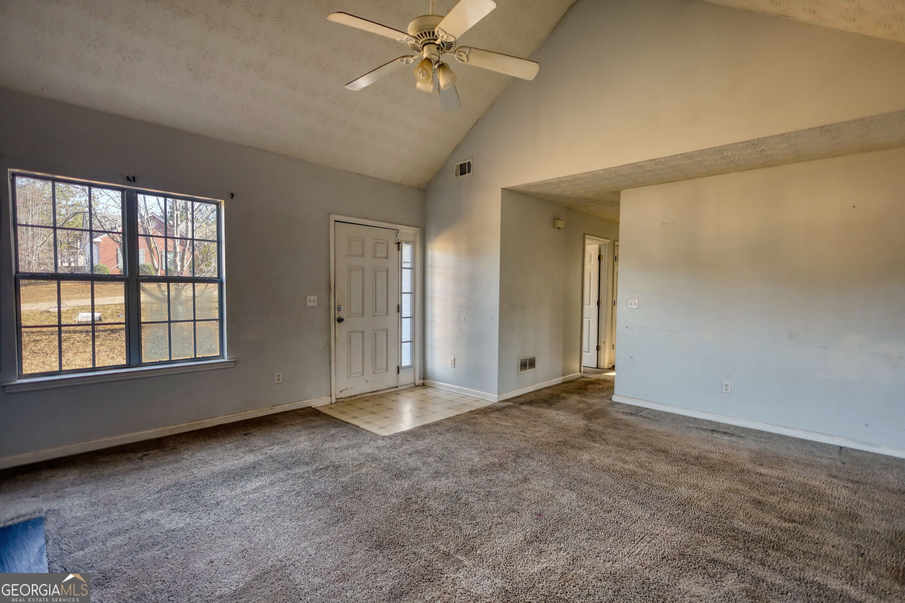 253 Nancy Street Monticello, GA 31064 - Photo 6 of 34 a view of an empty room with a window