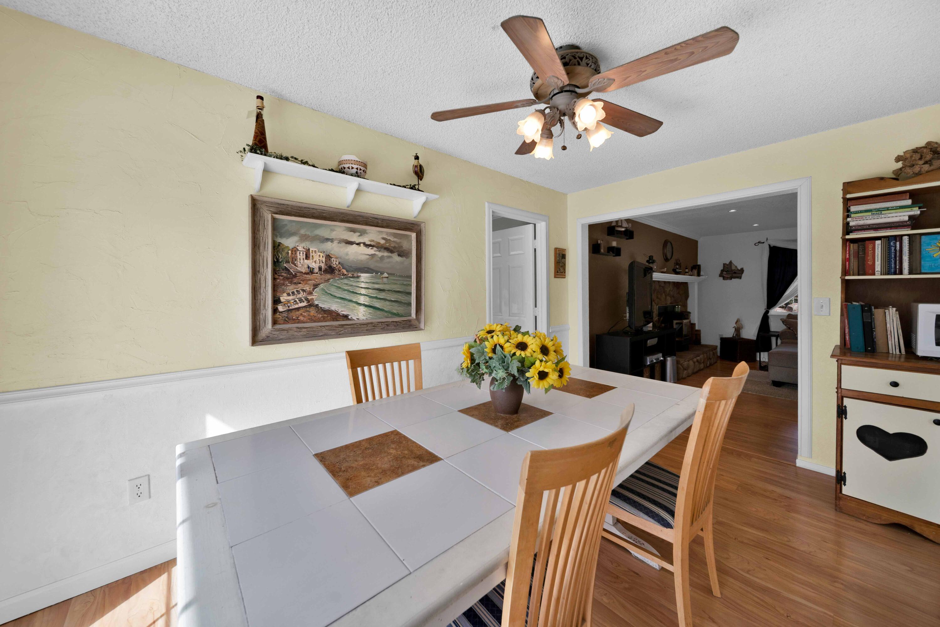 2195 Rancho Road Redding, CA 96002 - Photo 12 of 47 a view of a dining room with furniture and wooden floor