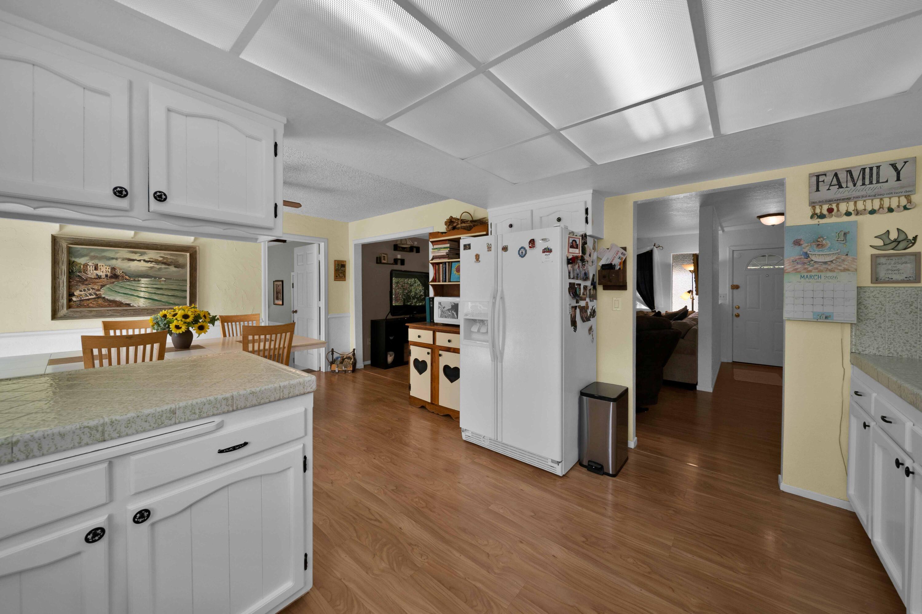 2195 Rancho Road Redding, CA 96002 - Photo 17 of 47 a view of a kitchen with refrigerator and window