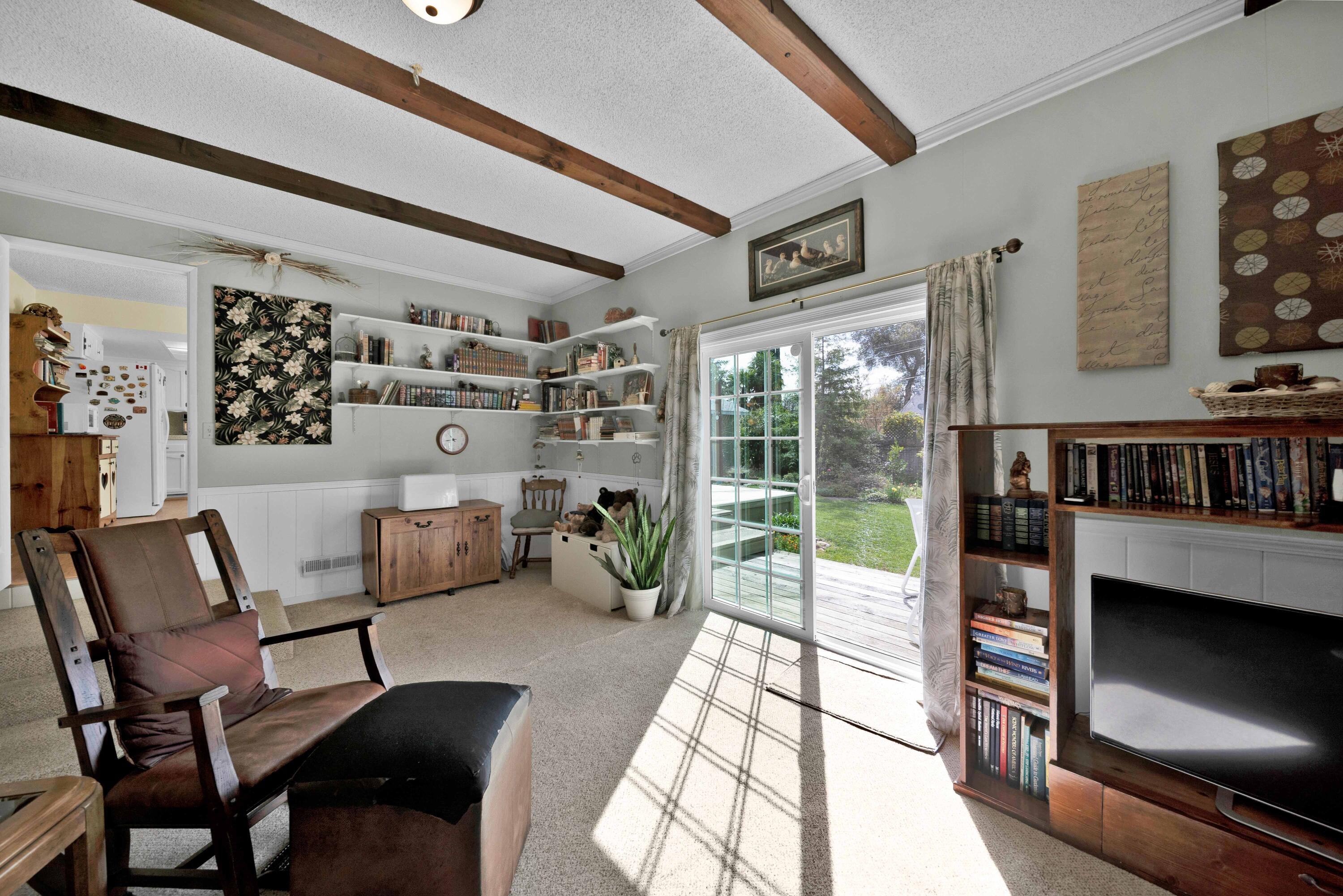 2195 Rancho Road Redding, CA 96002 - Photo 20 of 47 a living room with furniture and a floor to ceiling window