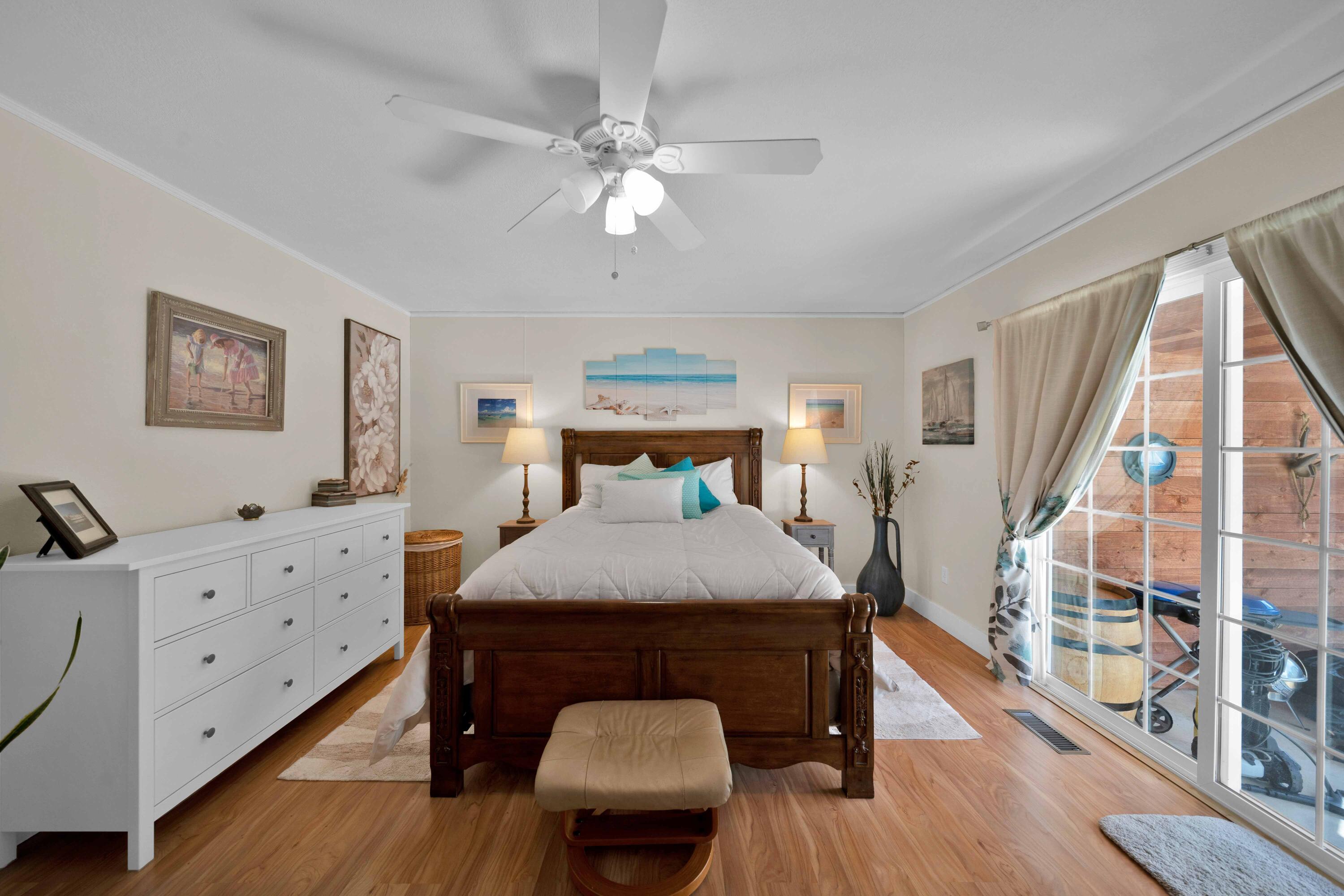 2195 Rancho Road Redding, CA 96002 - Photo 23 of 47 a bedroom with a bed and a chandelier