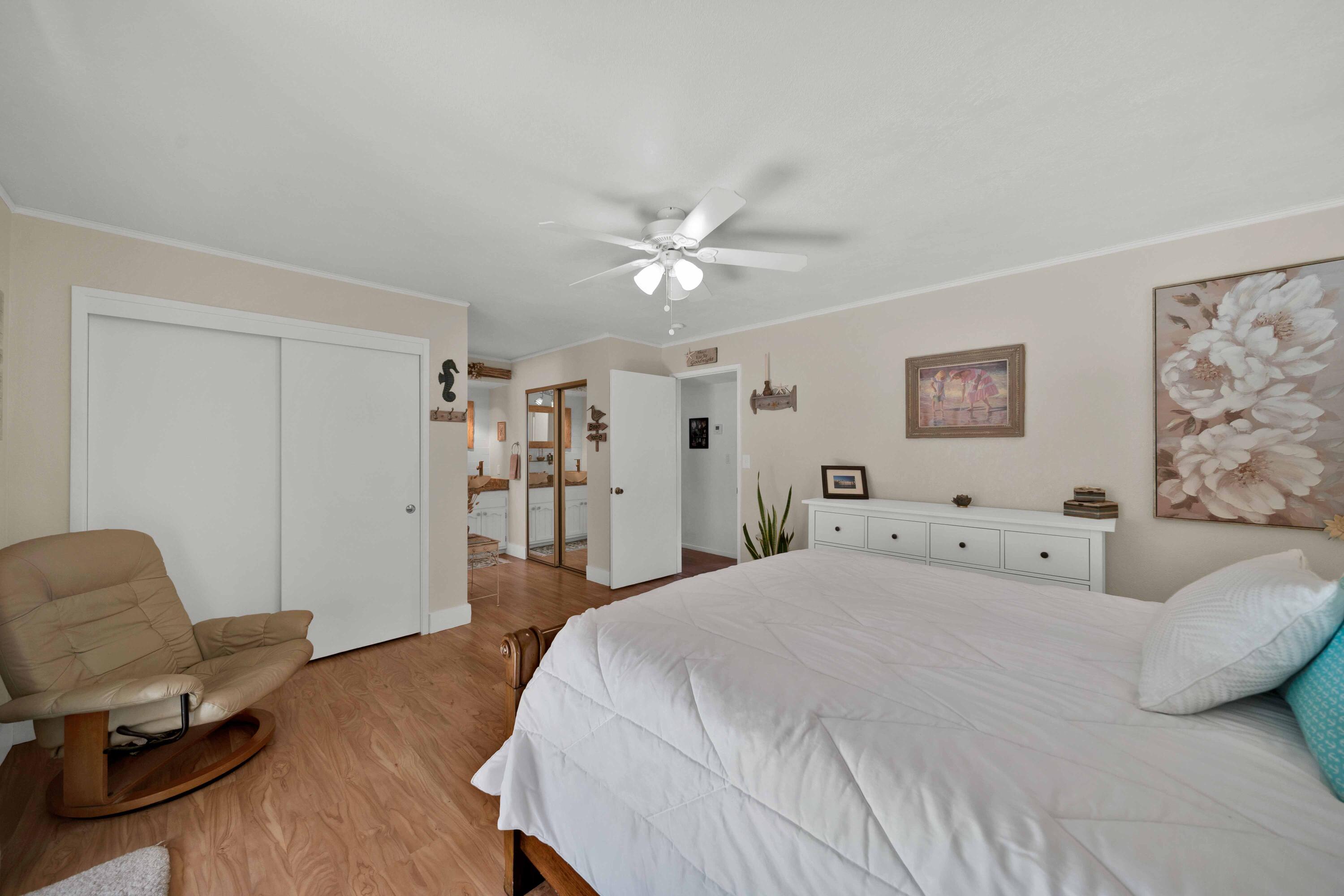 2195 Rancho Road Redding, CA 96002 - Photo 24 of 47 a spacious bedroom with a bed and a chair in it