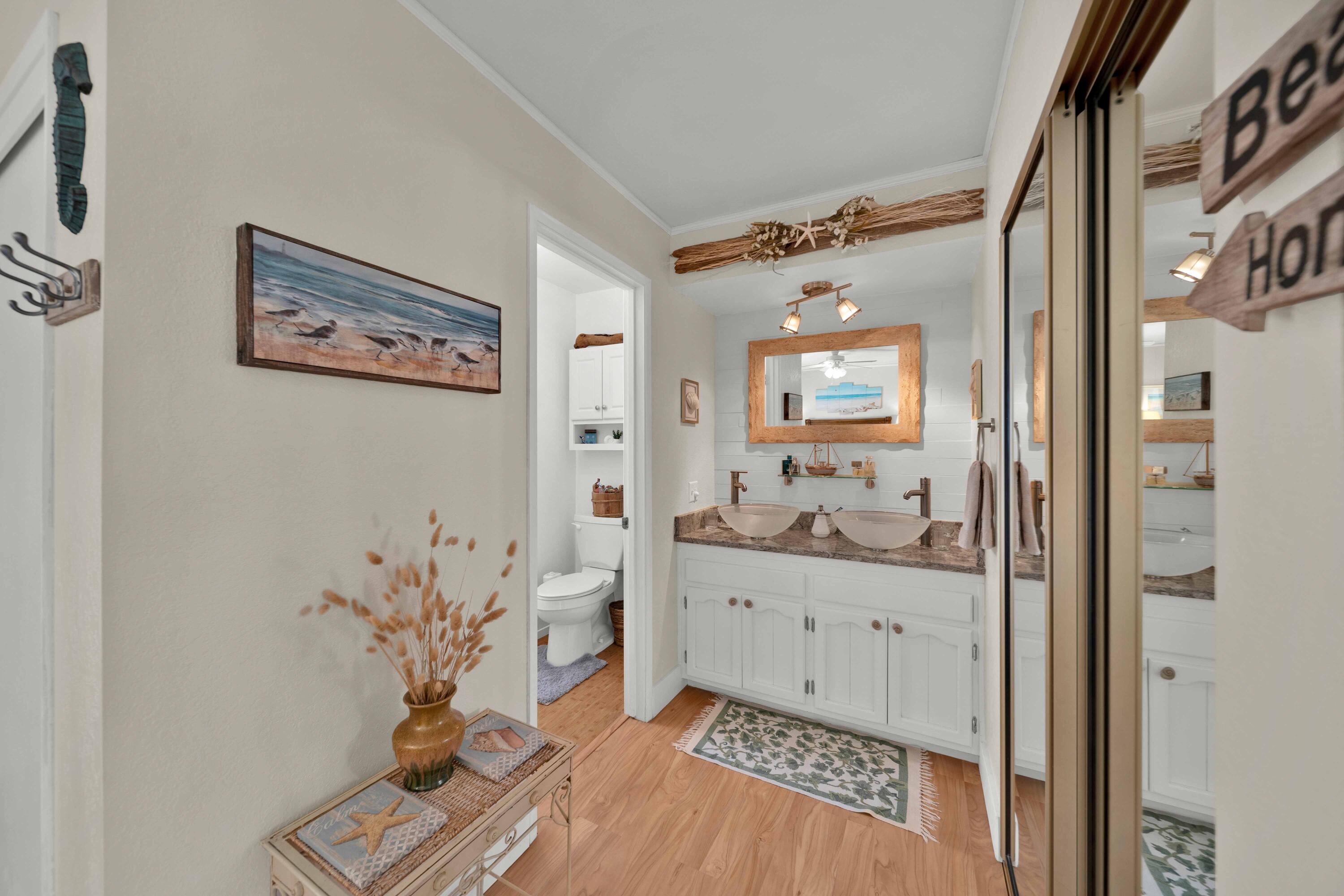 2195 Rancho Road Redding, CA 96002 - Photo 26 of 47 a hallway with a potted plant on the counter and mirror