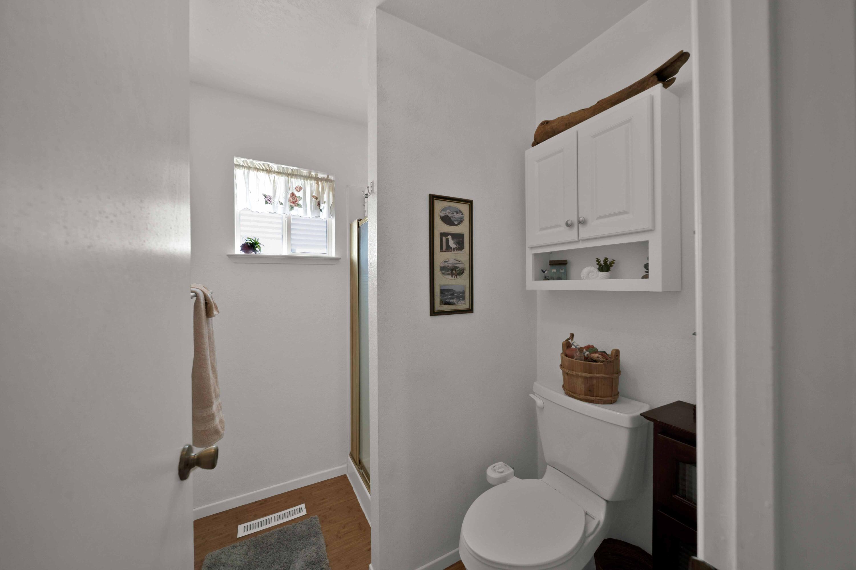 2195 Rancho Road Redding, CA 96002 - Photo 27 of 47 a white toilet sitting next to a bathroom sink