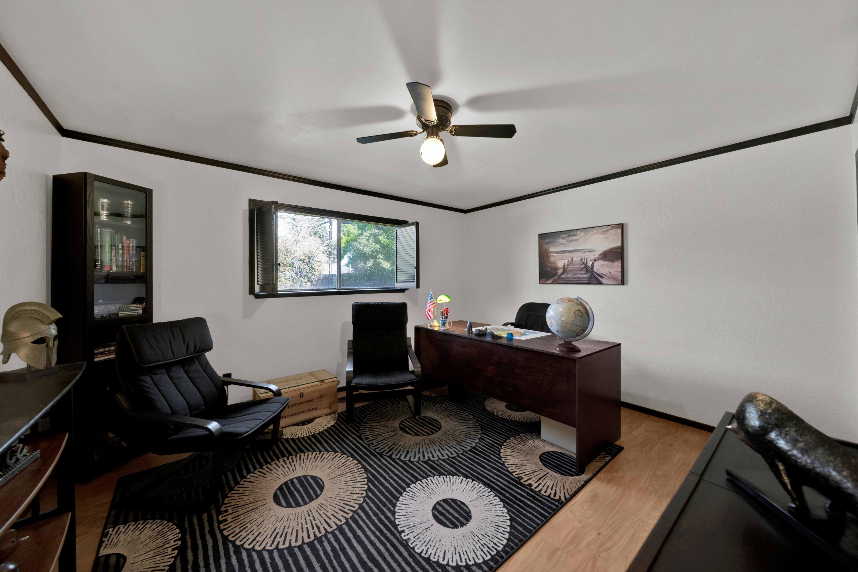 2195 Rancho Road Redding, CA 96002 - Photo 28 of 47 a work room with furniture a rug and a window