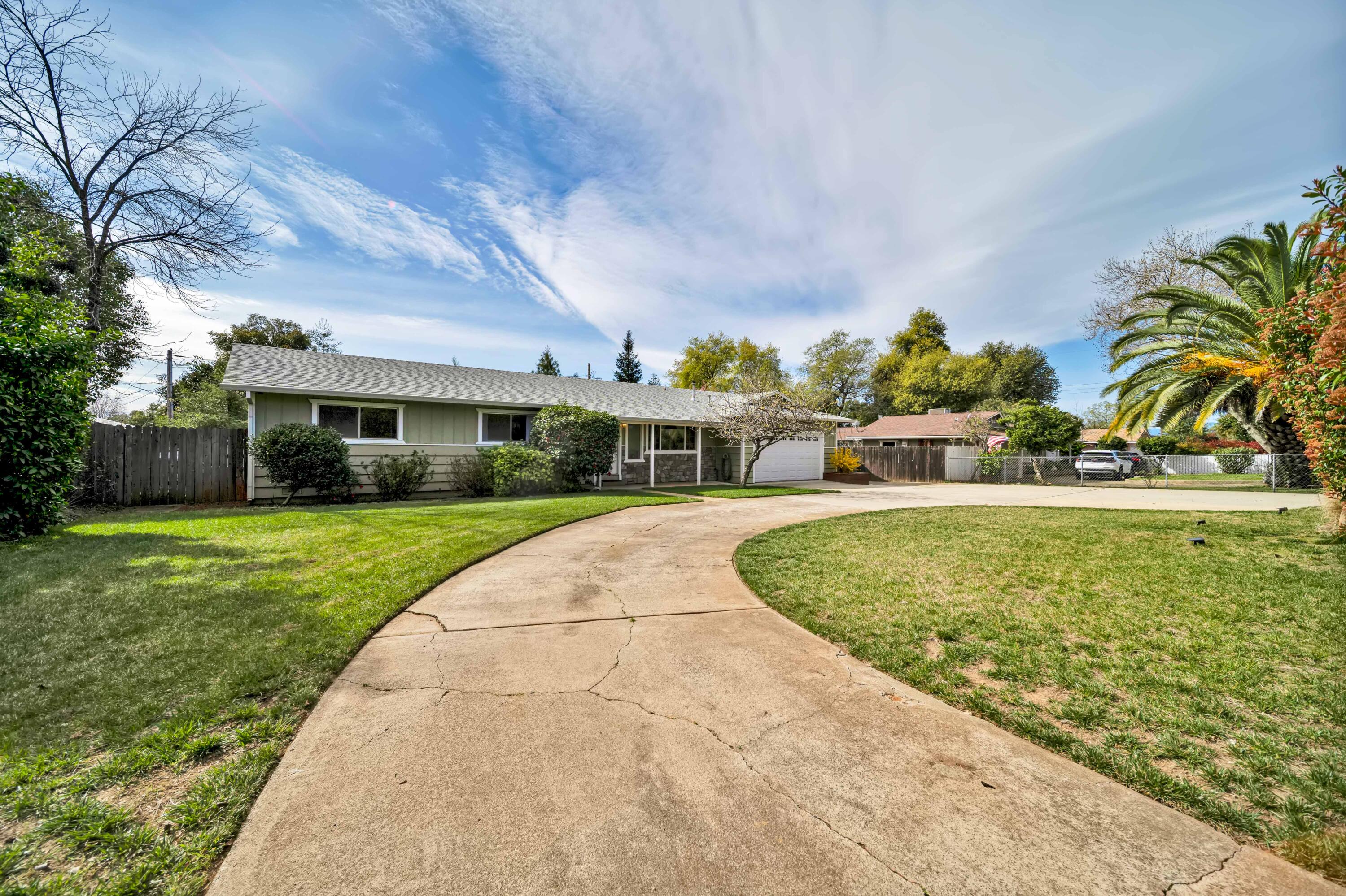 2195 Rancho Road Redding, CA 96002 - Photo 3 of 47 a front view of a house with a yard