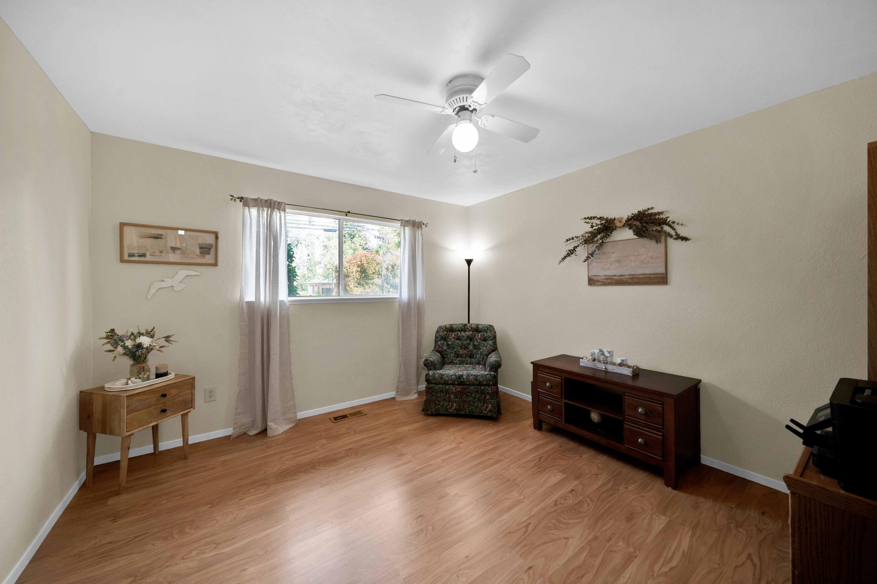 2195 Rancho Road Redding, CA 96002 - Photo 31 of 47 a living room with furniture and a chandelier