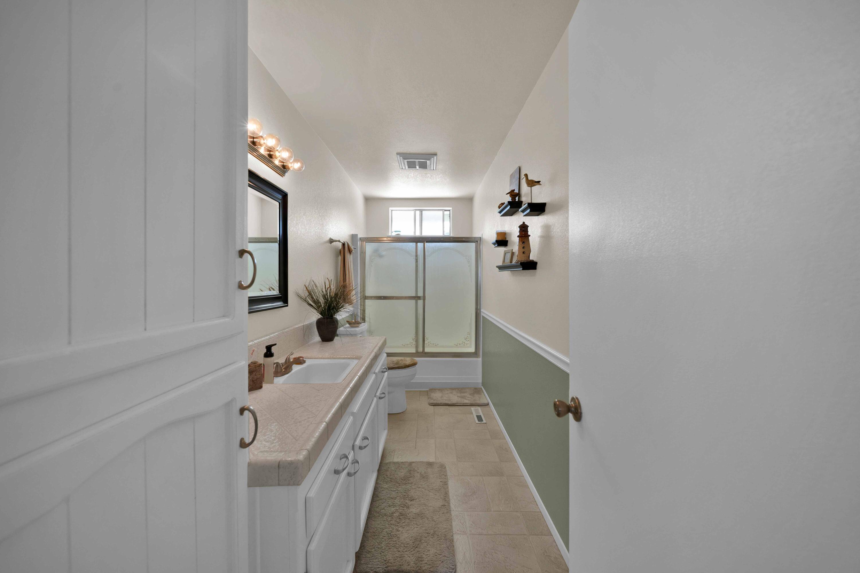 2195 Rancho Road Redding, CA 96002 - Photo 34 of 47 a bathroom with a sink a toilet and shower