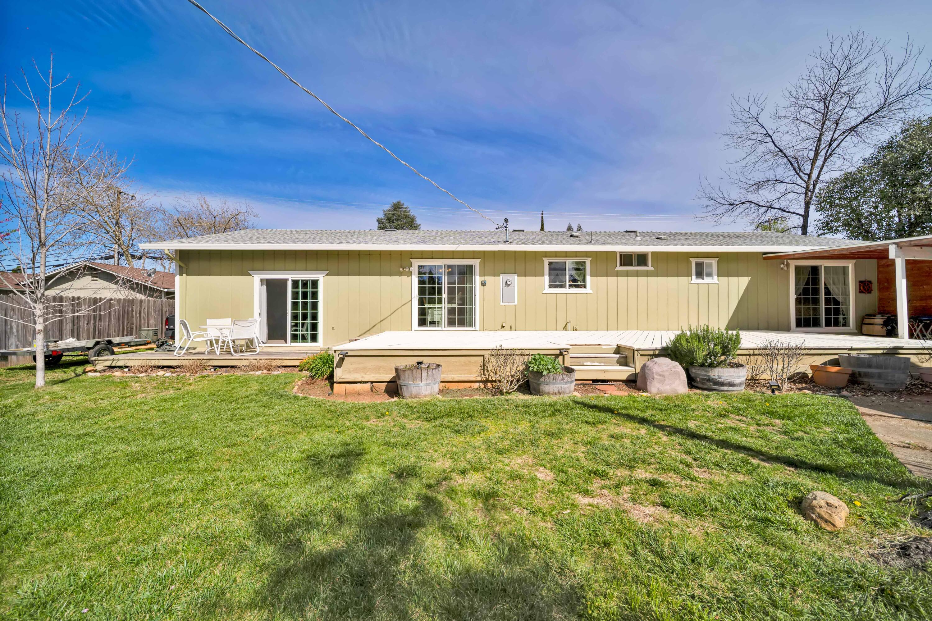 2195 Rancho Road Redding, CA 96002 - Photo 35 of 47 a view of a house with backyard porch and sitting area