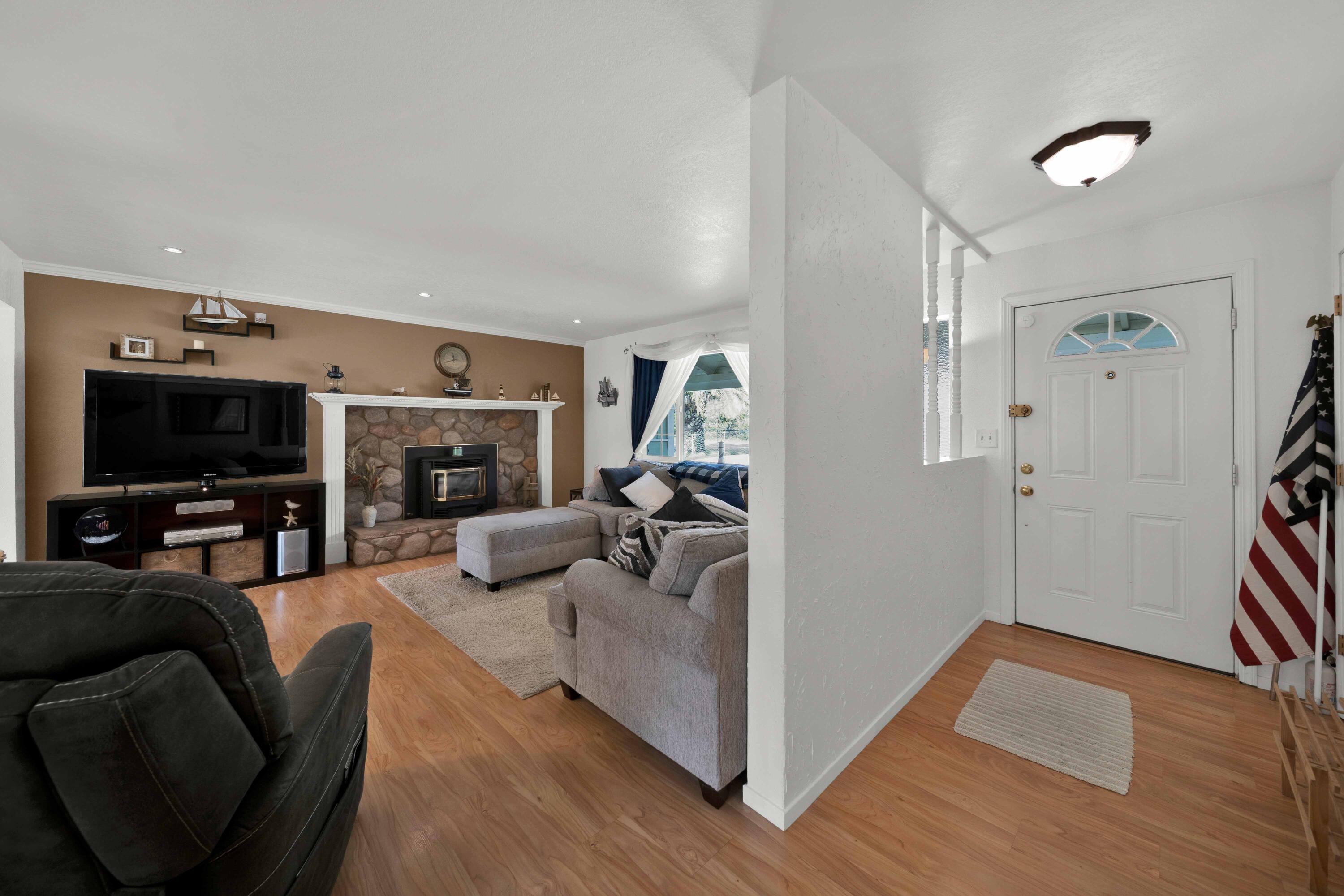 2195 Rancho Road Redding, CA 96002 - Photo 7 of 47 a living room with furniture and a flat screen tv