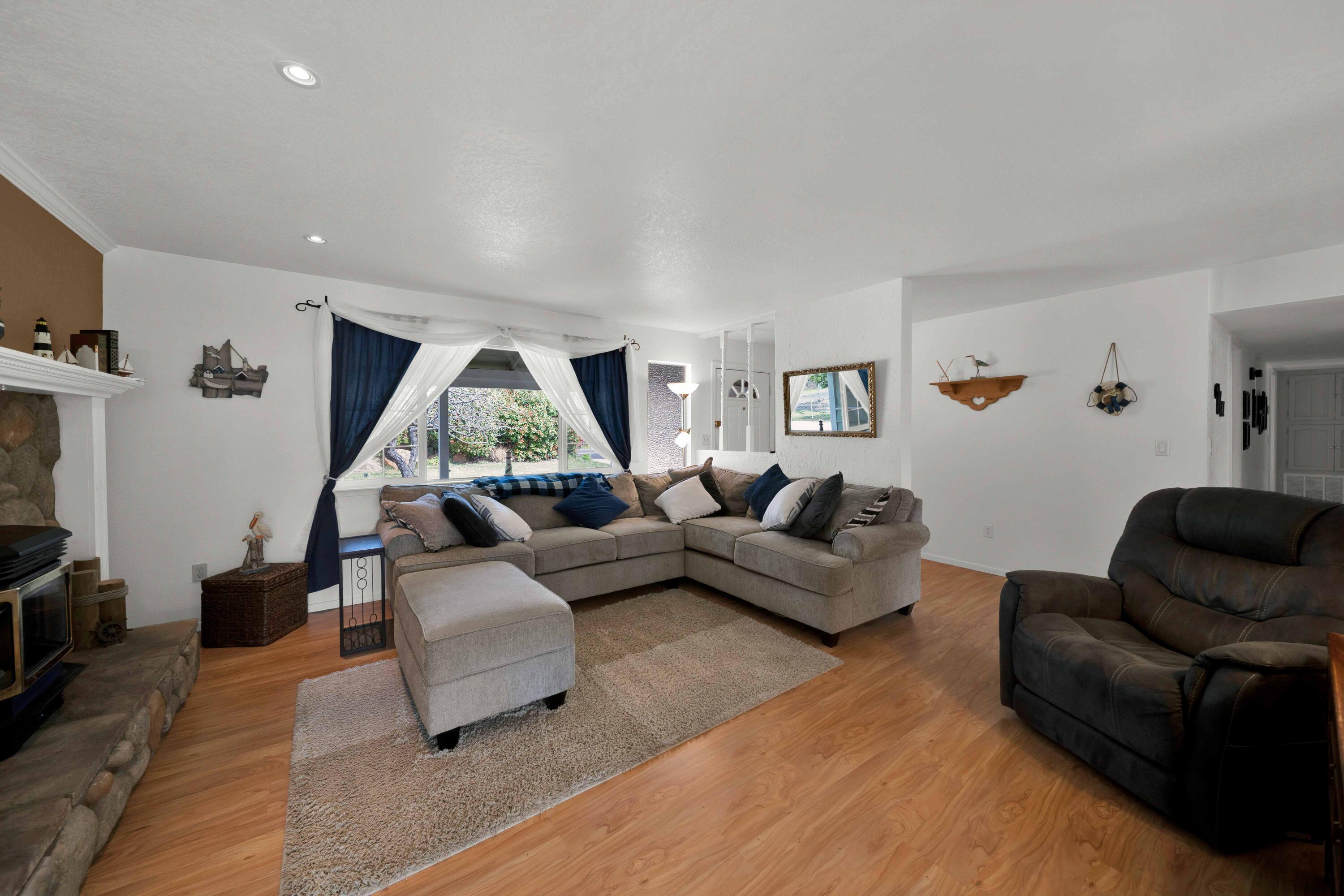 2195 Rancho Road Redding, CA 96002 - Photo 9 of 47 a living room with furniture and a flat screen tv