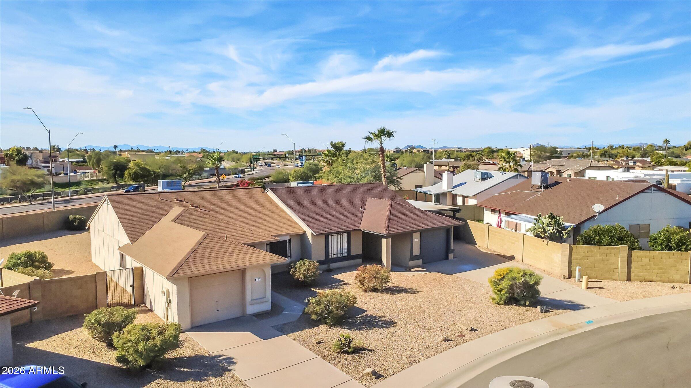 1705 East Grandview Road Phoenix, AZ 85022 - Photo 18 of 19 a view of a house with a terrace