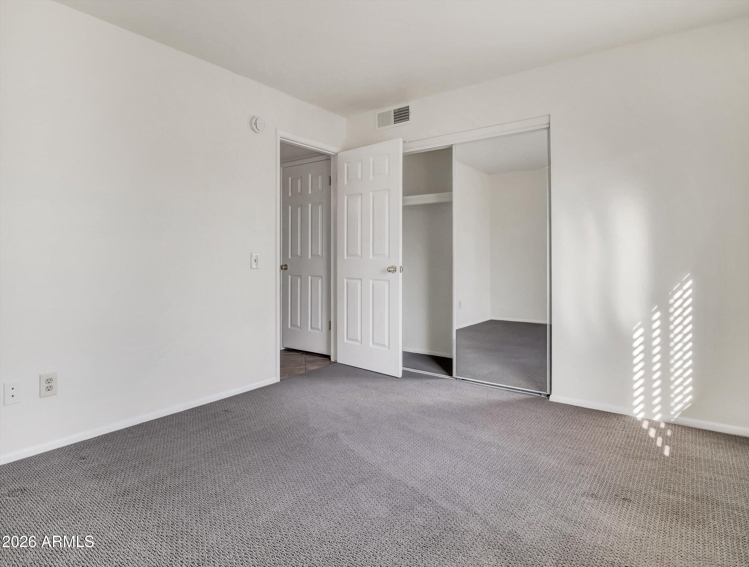 1705 East Grandview Road Phoenix, AZ 85022 - Photo 6 of 19 a view of an empty room with a fireplace