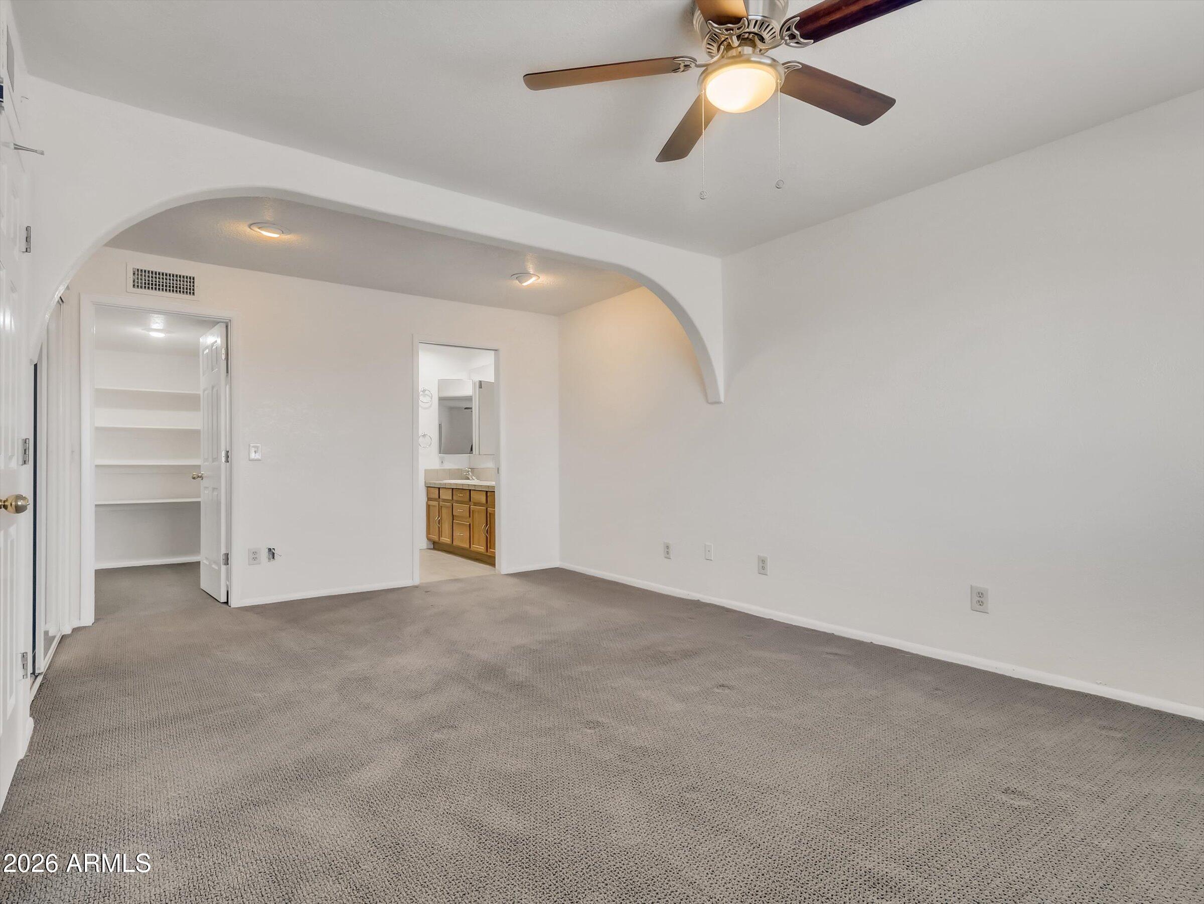 1705 East Grandview Road Phoenix, AZ 85022 - Photo 9 of 19 an empty room with closet and windows