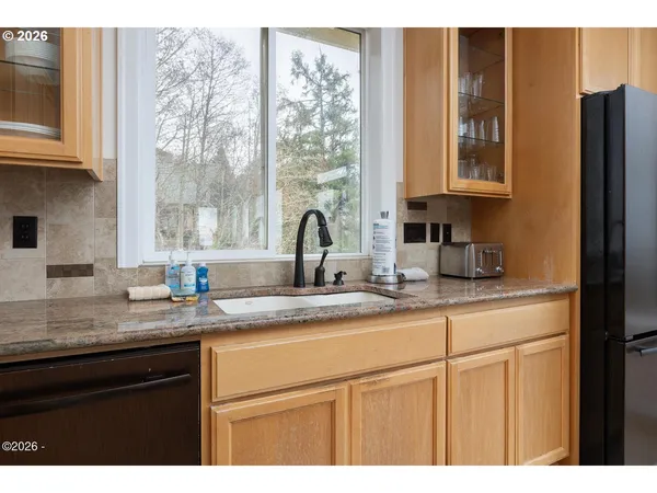 a kitchen with appliances cabinets and a sink