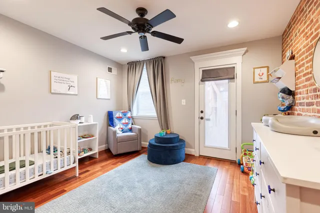a bedroom with furniture and a chandelier