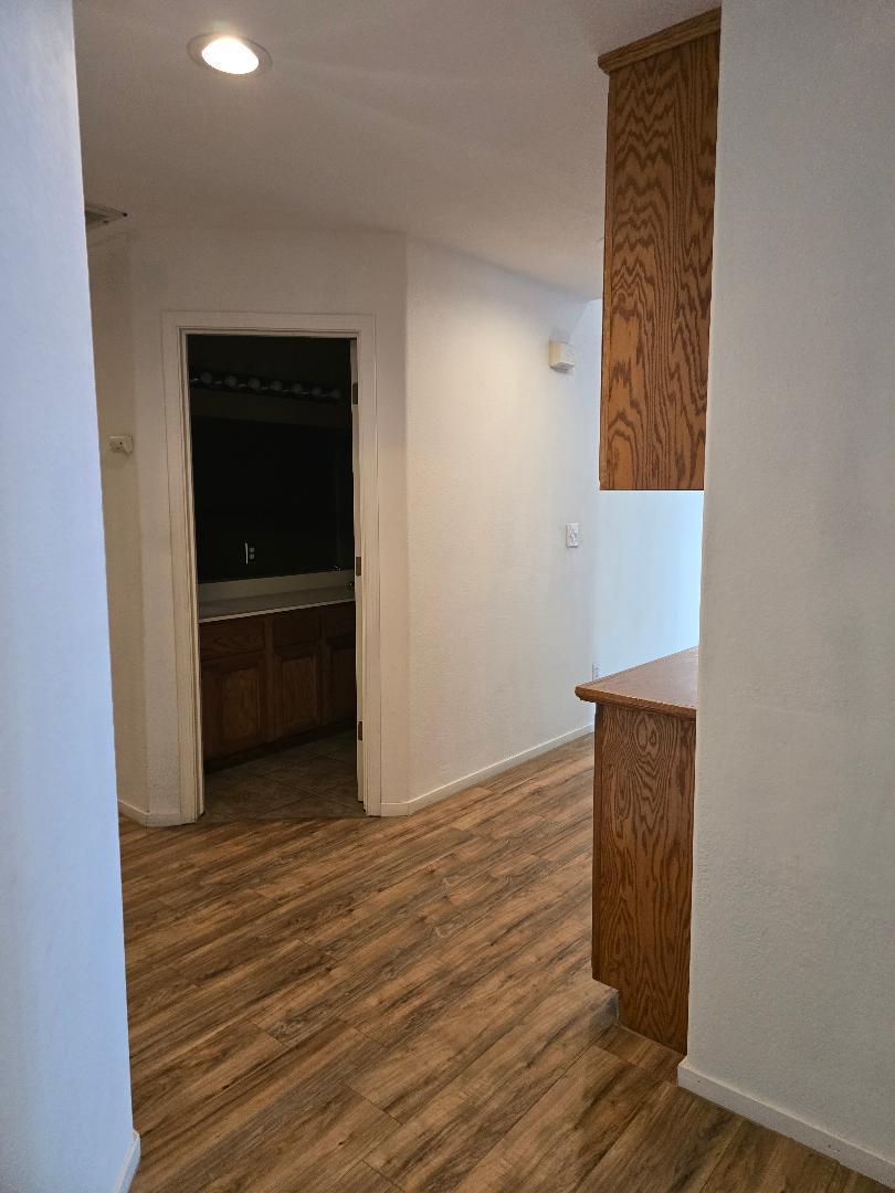29124 Rio Verde Drive Gustine, CA 95322 - Photo 16 of 19 a view of an empty room with wooden floor and closet