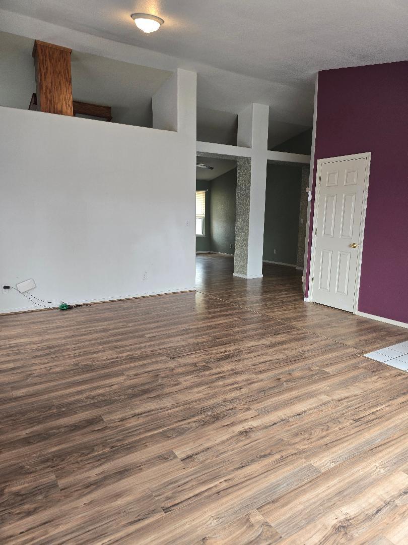 29124 Rio Verde Drive Gustine, CA 95322 - Photo 2 of 19 a view of an empty room with wooden floor