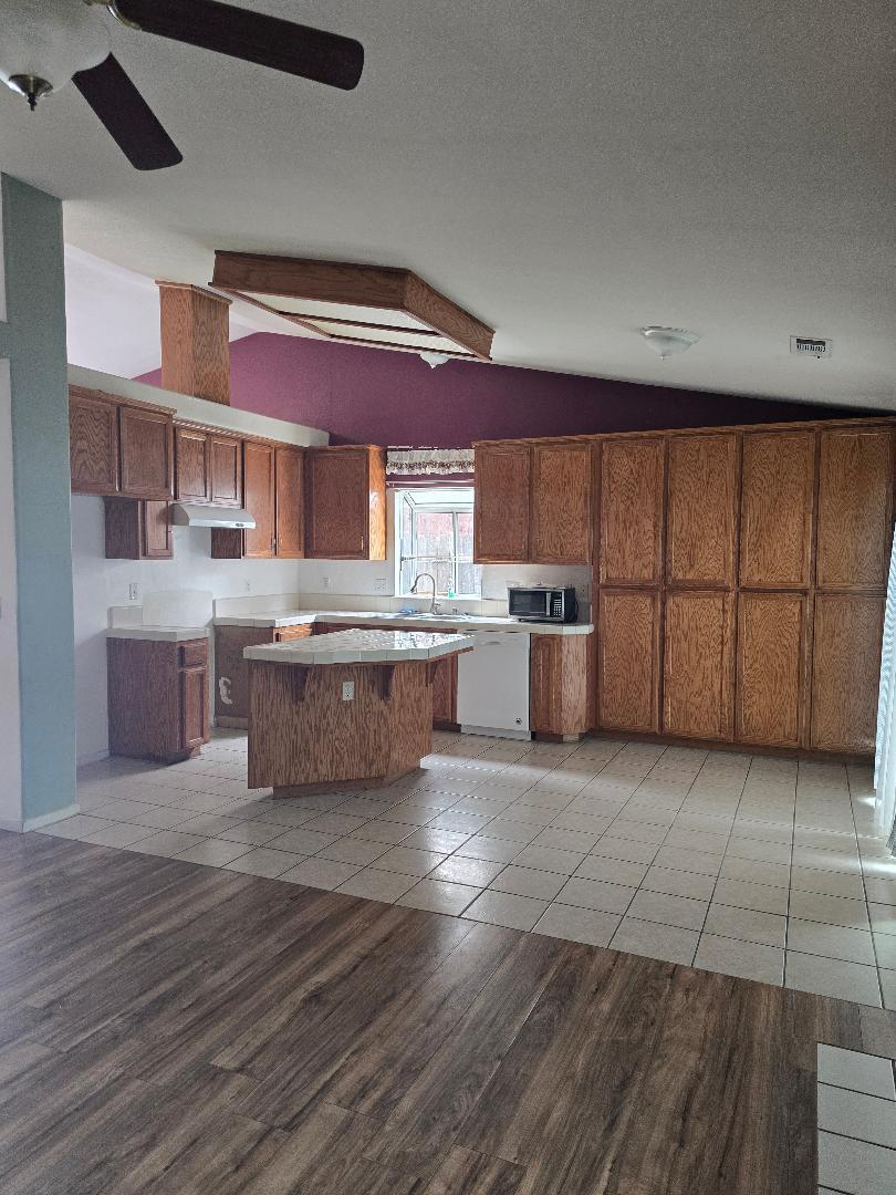 29124 Rio Verde Drive Gustine, CA 95322 - Photo 5 of 19 a large kitchen with stainless steel appliances granite countertop a large counter top a sink and cabinets
