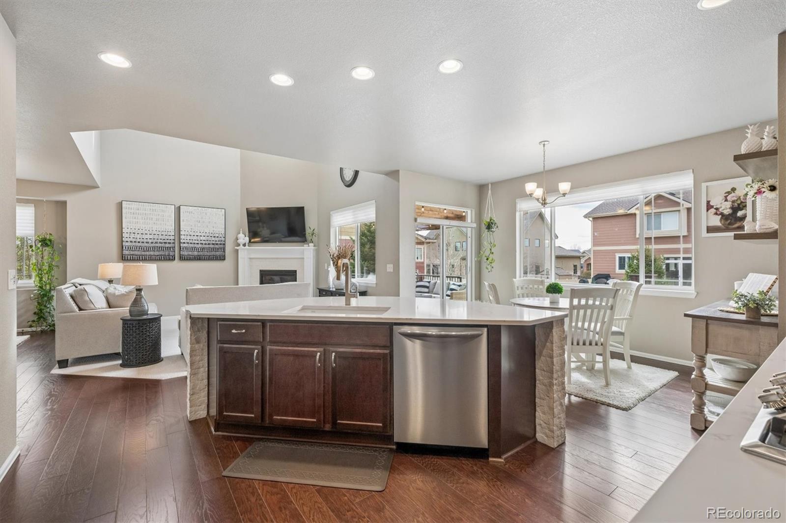 8809 Foxfire Street Firestone, CO 80504 - Photo 12 of 40 a large kitchen with lots of counter space and windows