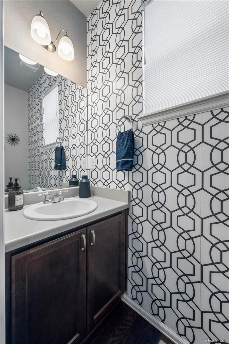 8809 Foxfire Street Firestone, CO 80504 - Photo 14 of 40 a bathroom with a sink and a mirror