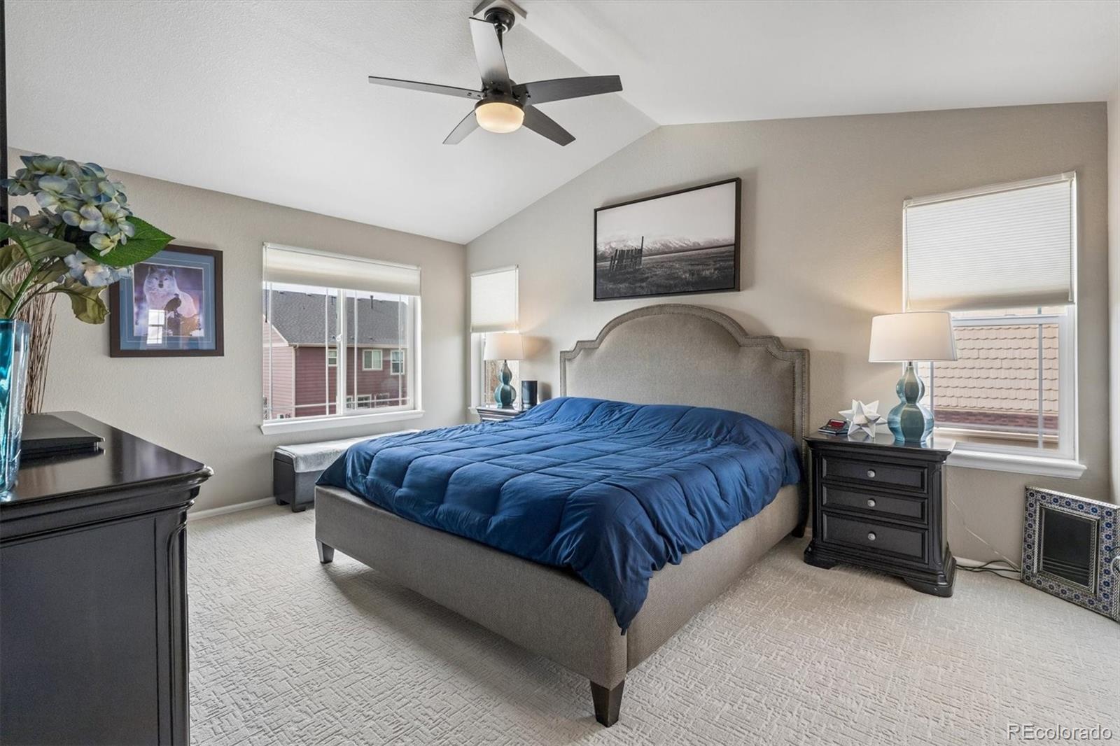 8809 Foxfire Street Firestone, CO 80504 - Photo 16 of 40 a spacious bedroom with a bed and wooden floor