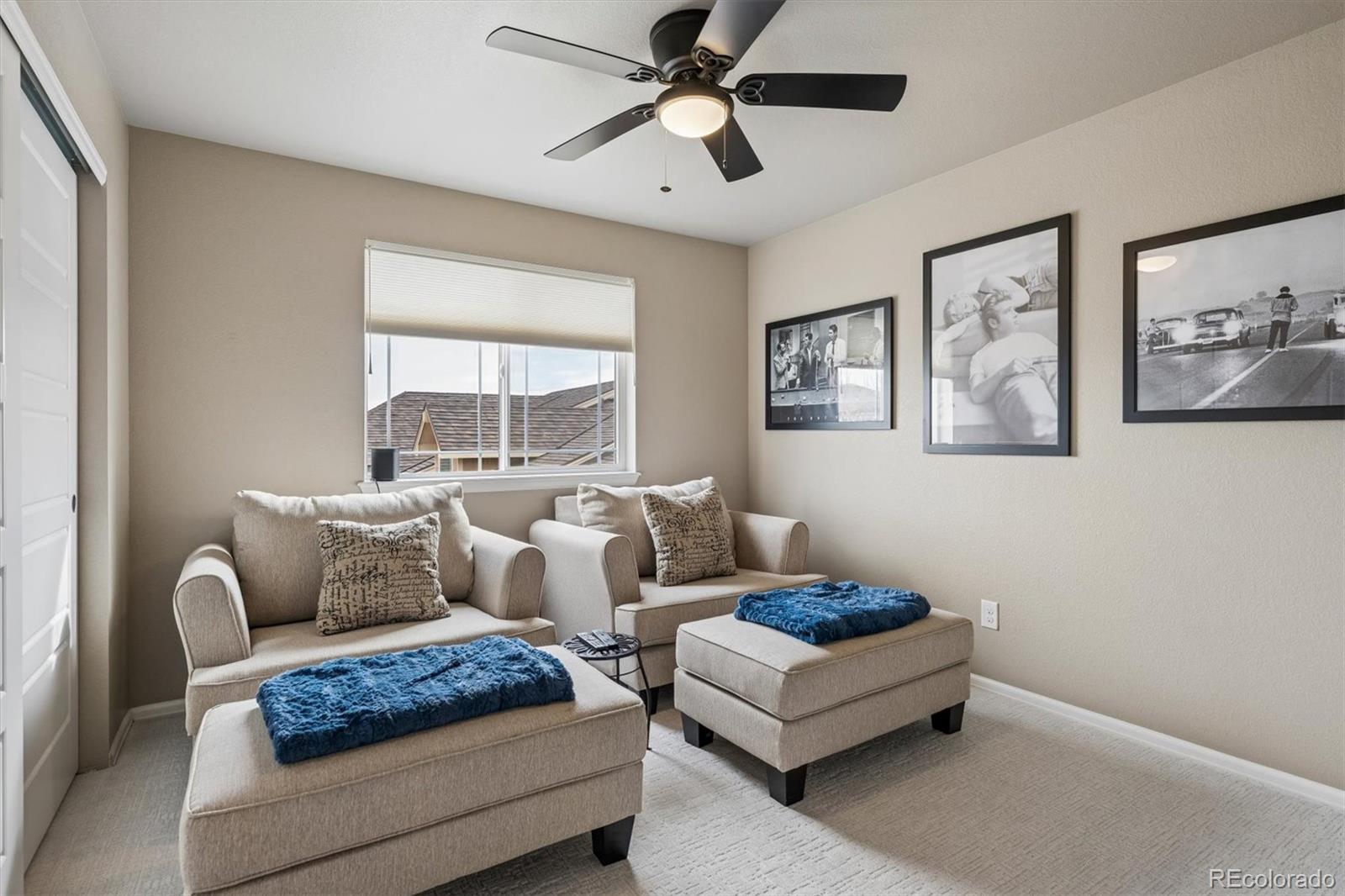 8809 Foxfire Street Firestone, CO 80504 - Photo 22 of 40 a living room with furniture and a large window