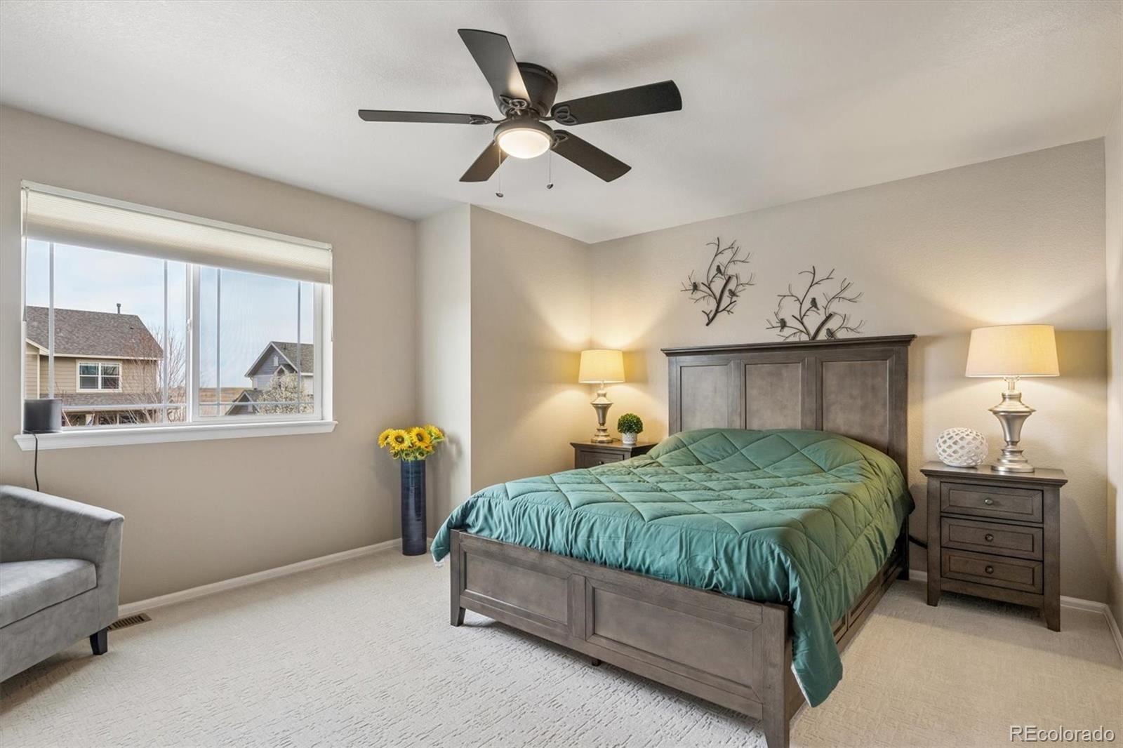 8809 Foxfire Street Firestone, CO 80504 - Photo 23 of 40 a bedroom with a bed and window