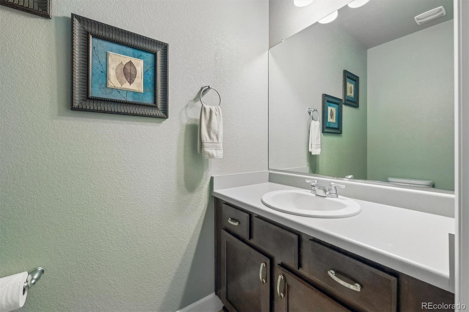 8809 Foxfire Street Firestone, CO 80504 - Photo 27 of 40 a bathroom with a sink and a mirror