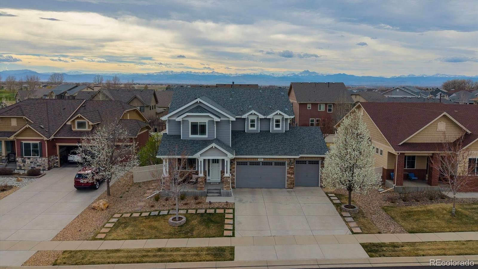 8809 Foxfire Street Firestone, CO 80504 - Photo 35 of 40 front view of house with a yard