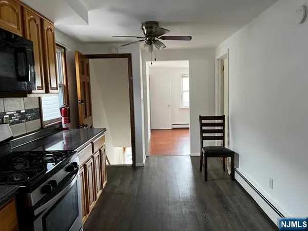 a kitchen with stainless steel appliances a stove and a refrigerator